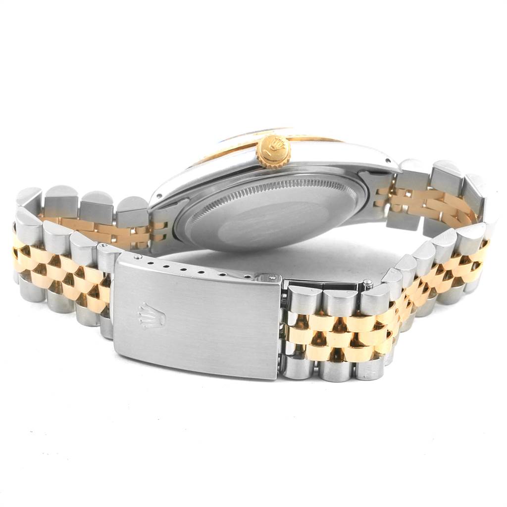 The image shows the back case and the two-tone bracelet of the Rolex Vintage Collection 16013 Men
s Stainless Steel Champagne Dial 16013 Men
s Stainless Steel Champagne Dial watch, highlighting the clasp and crown.