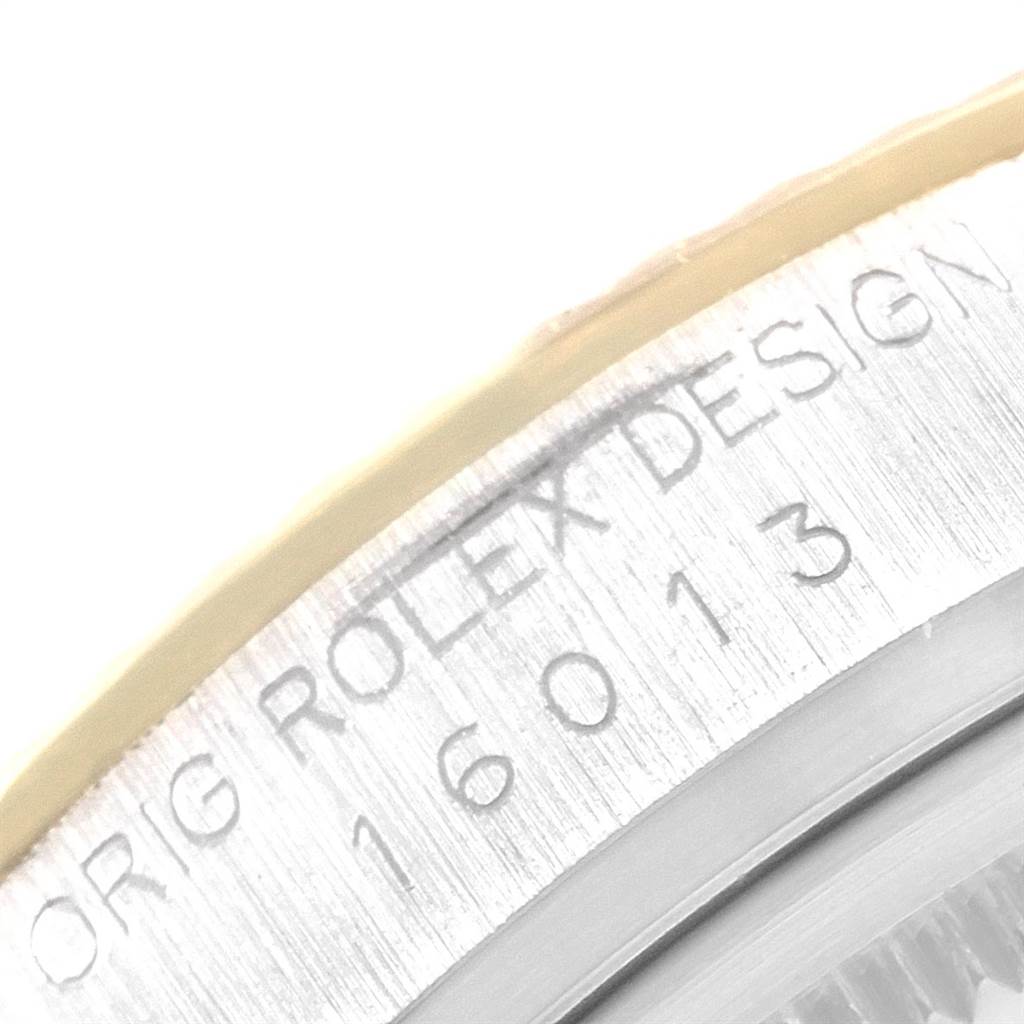 This close-up shows the engraved bezel of a Rolex Vintage Collection 16013 Men
s Stainless Steel Champagne Dial 16013 Men
s Stainless Steel Champagne Dial model, featuring part of the design and serial number "16013."