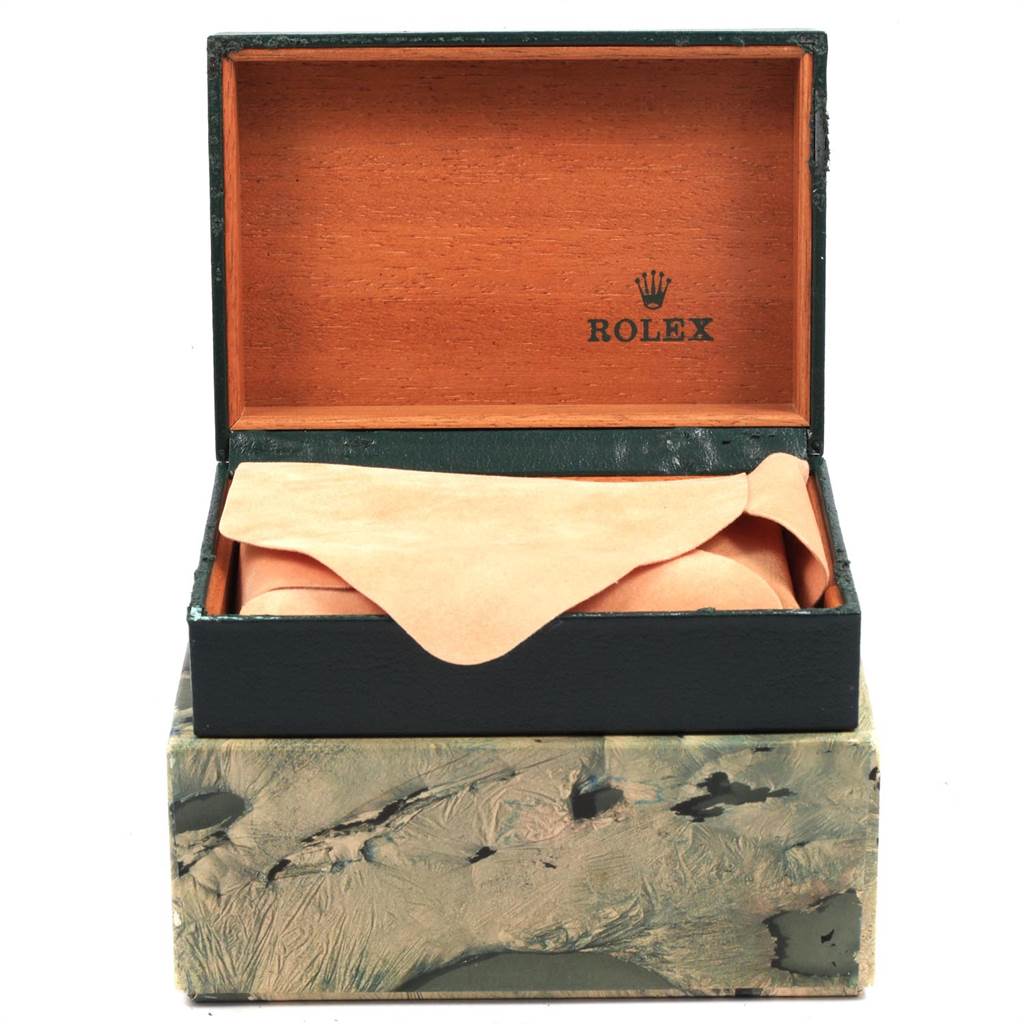 The image shows an open box of a Rolex Vintage Collection 16013 Men
s Stainless Steel Champagne Dial 16013 Men
s Stainless Steel Champagne Dial model, partially revealing the watch inside.