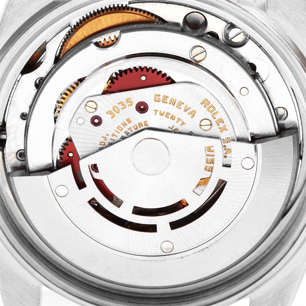 Close-up view of the internal mechanism of the Vintage Collection model by Rolex, showcasing gears and inscriptions.
