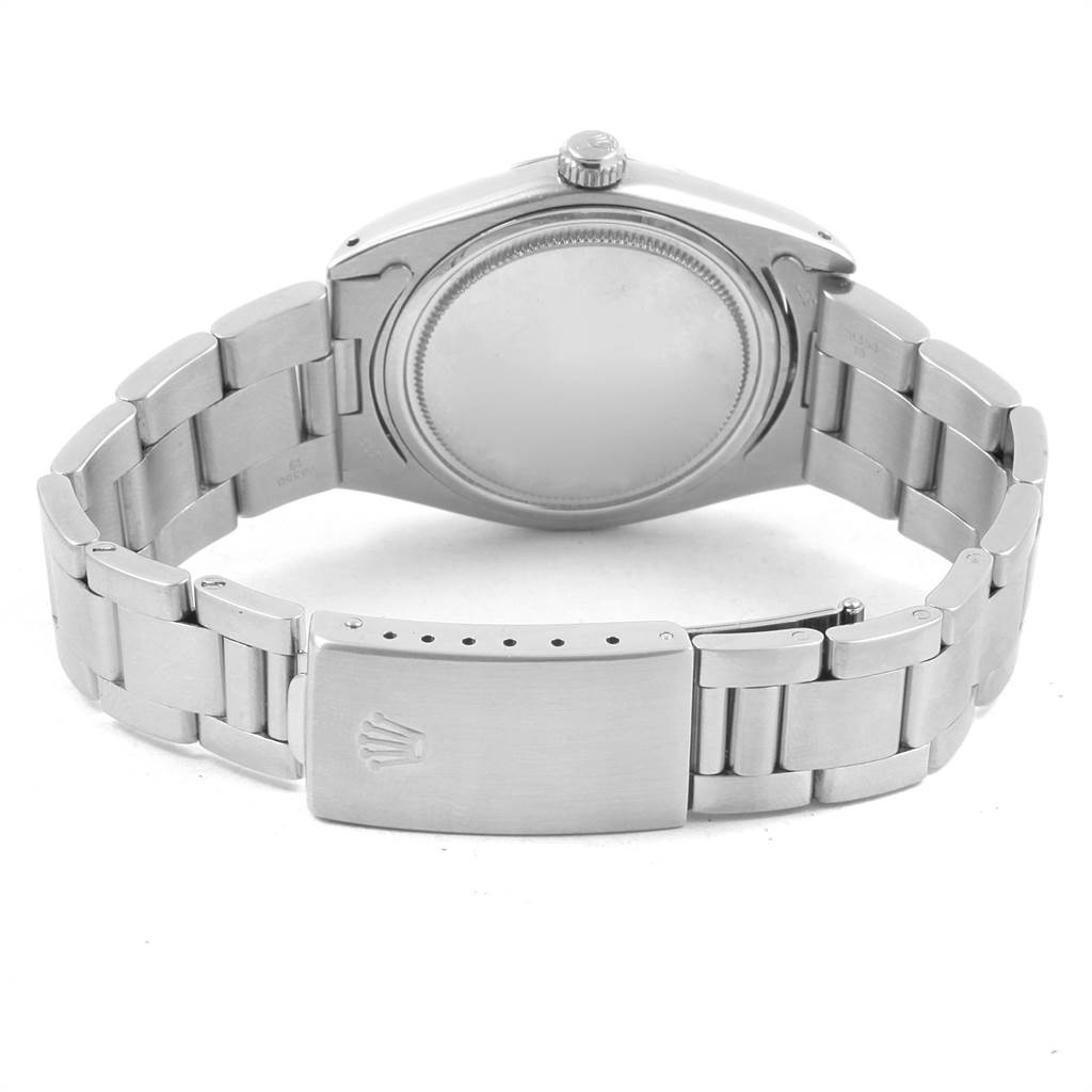 The image shows the back and bracelet of a Rolex Vintage Collection 6694 Men
s Stainless Steel Silver Dial 6694 Men
s Stainless Steel Silver Dial model watch.