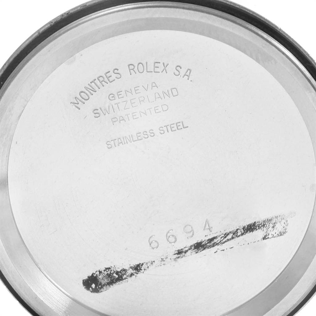 The image shows the inner case back of a Rolex Vintage Collection 6694 Men
s Stainless Steel Silver Dial 6694 Men
s Stainless Steel Silver Dial model, highlighting the brand
s engravings and model number.