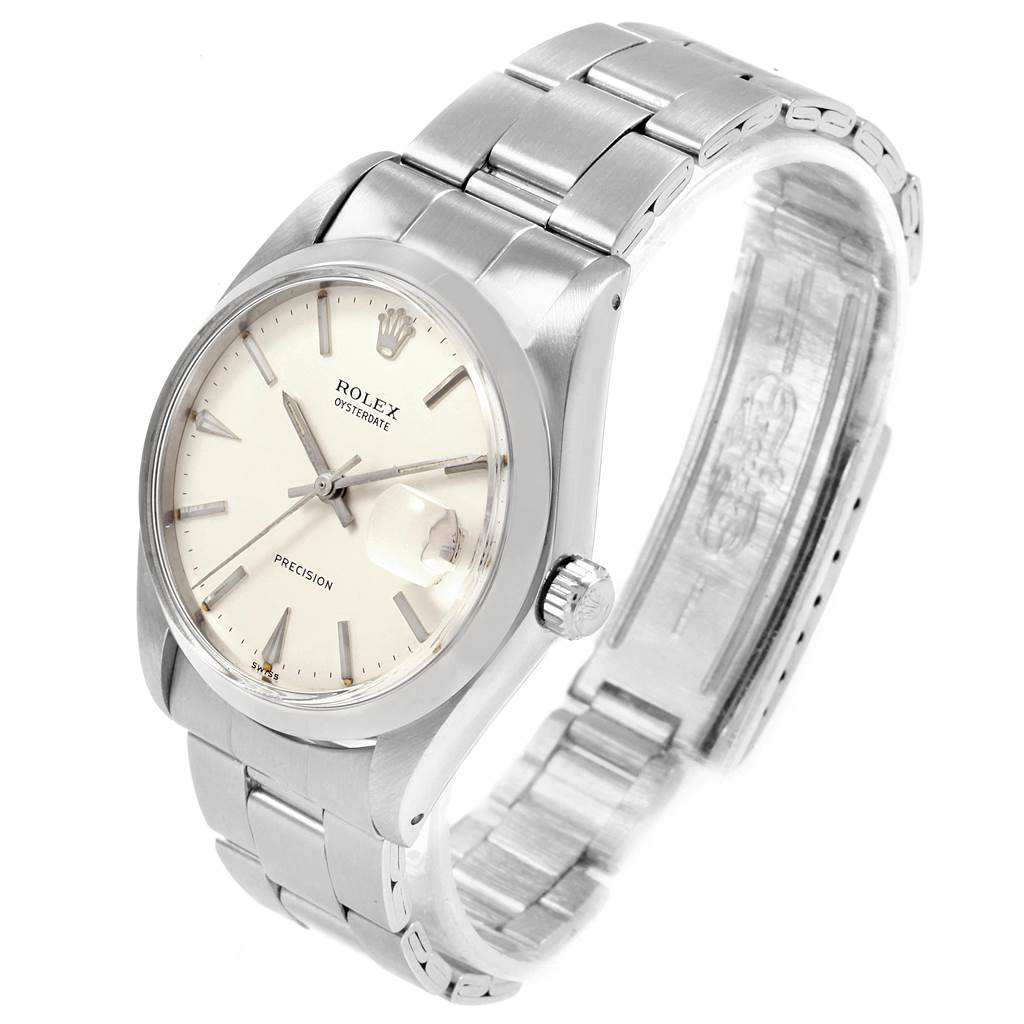 The image shows the Rolex Vintage Collection 6694 Men
s Stainless Steel Silver Dial 6694 Men
s Stainless Steel Silver Dial watch at a three-quarter angle, highlighting the dial, hands, crown, and metal strap.