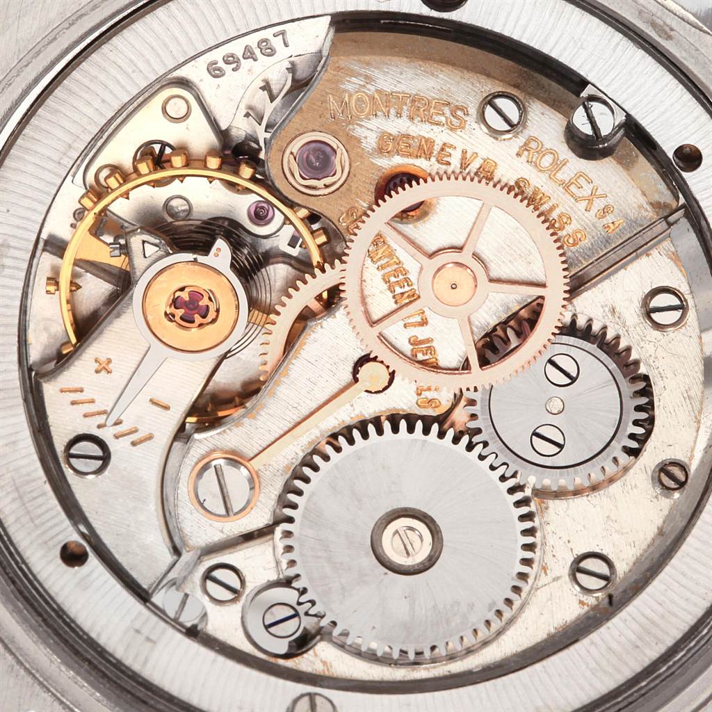 The image shows the intricate movement mechanisms and internal gears of a Rolex Vintage Collection 6694 Men
s Stainless Steel Silver Dial 6694 Men
s Stainless Steel Silver Dial watch from a top-down angle.