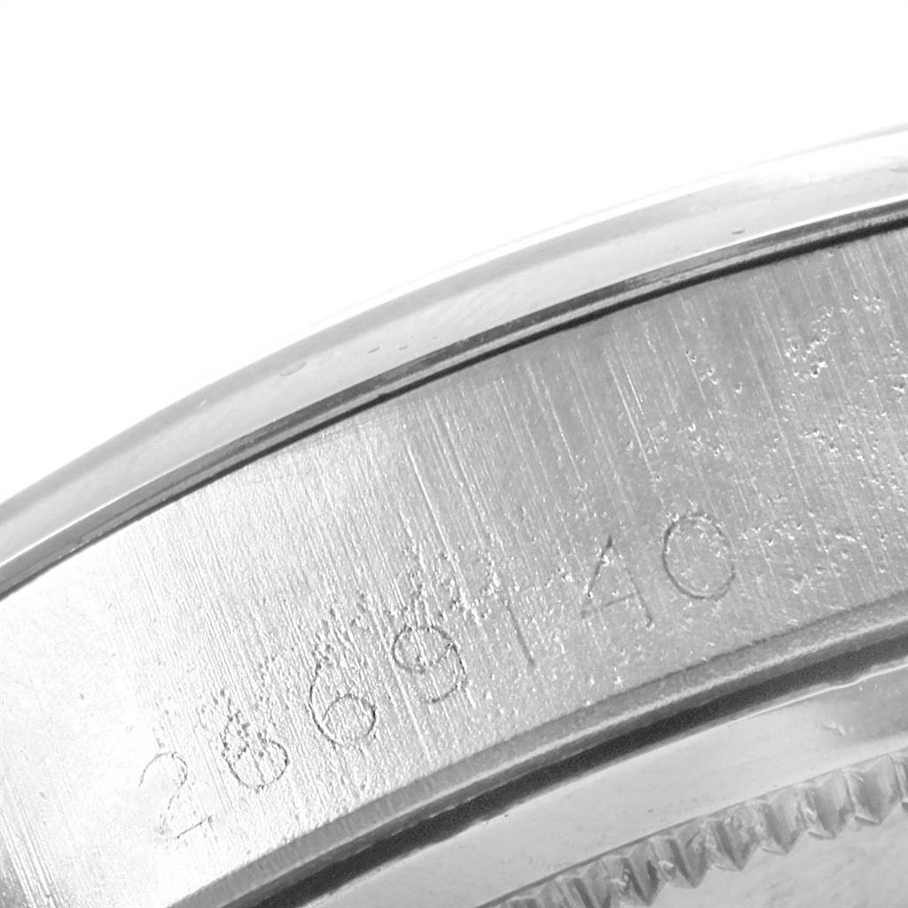 This image shows a close-up of the serial number on the case of a Rolex Vintage Collection 6694 Men
s Stainless Steel Silver Dial 6694 Men
s Stainless Steel Silver Dial watch.
