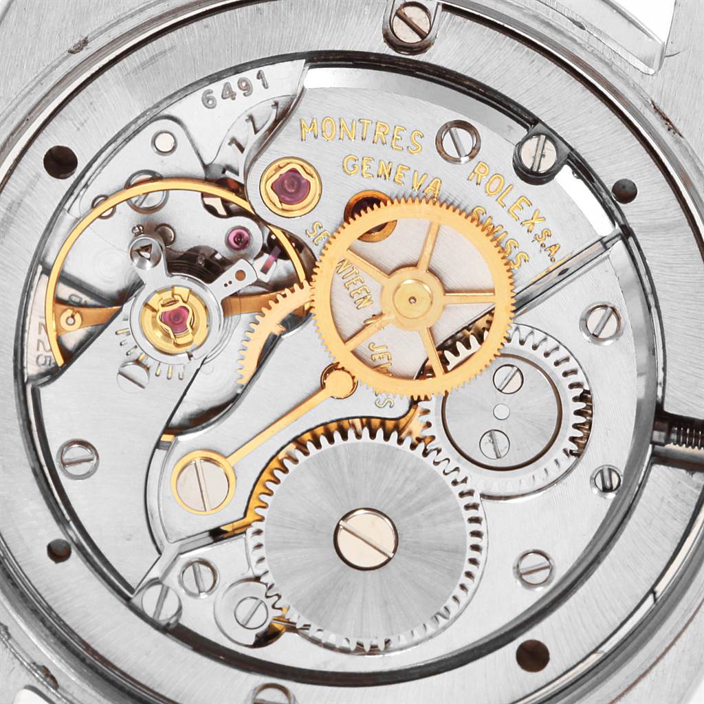 Close-up of the Rolex Vintage Collection 6694 Men
s Stainless Steel Silver Dial 6694 Men
s Stainless Steel Silver Dial watch movement showing gears and internal mechanisms from a back angle.