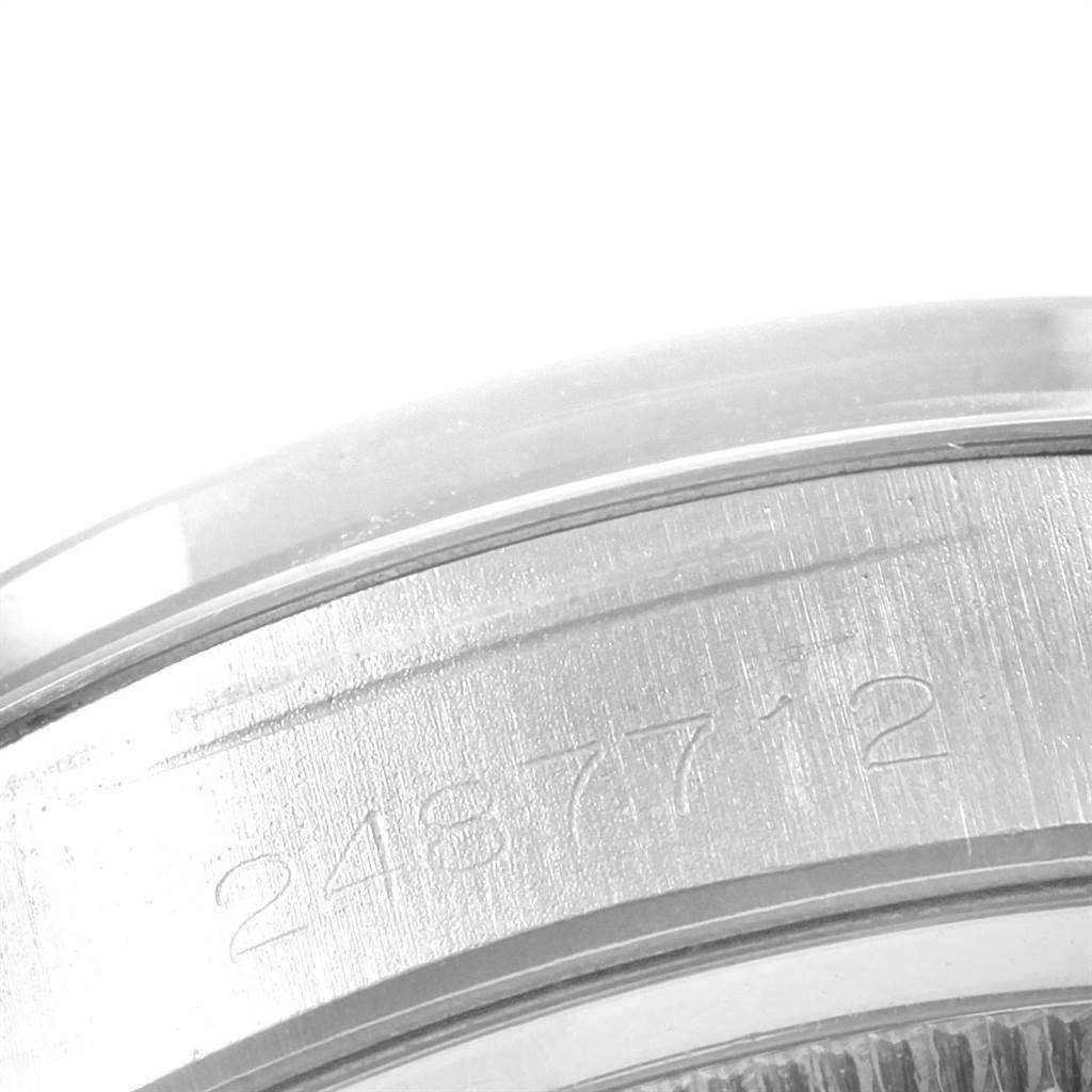 This close-up image shows the engraved serial number on the side of a Rolex Vintage Collection 6694 Men
s Stainless Steel Silver Dial 6694 Men
s Stainless Steel Silver Dial model watch case.