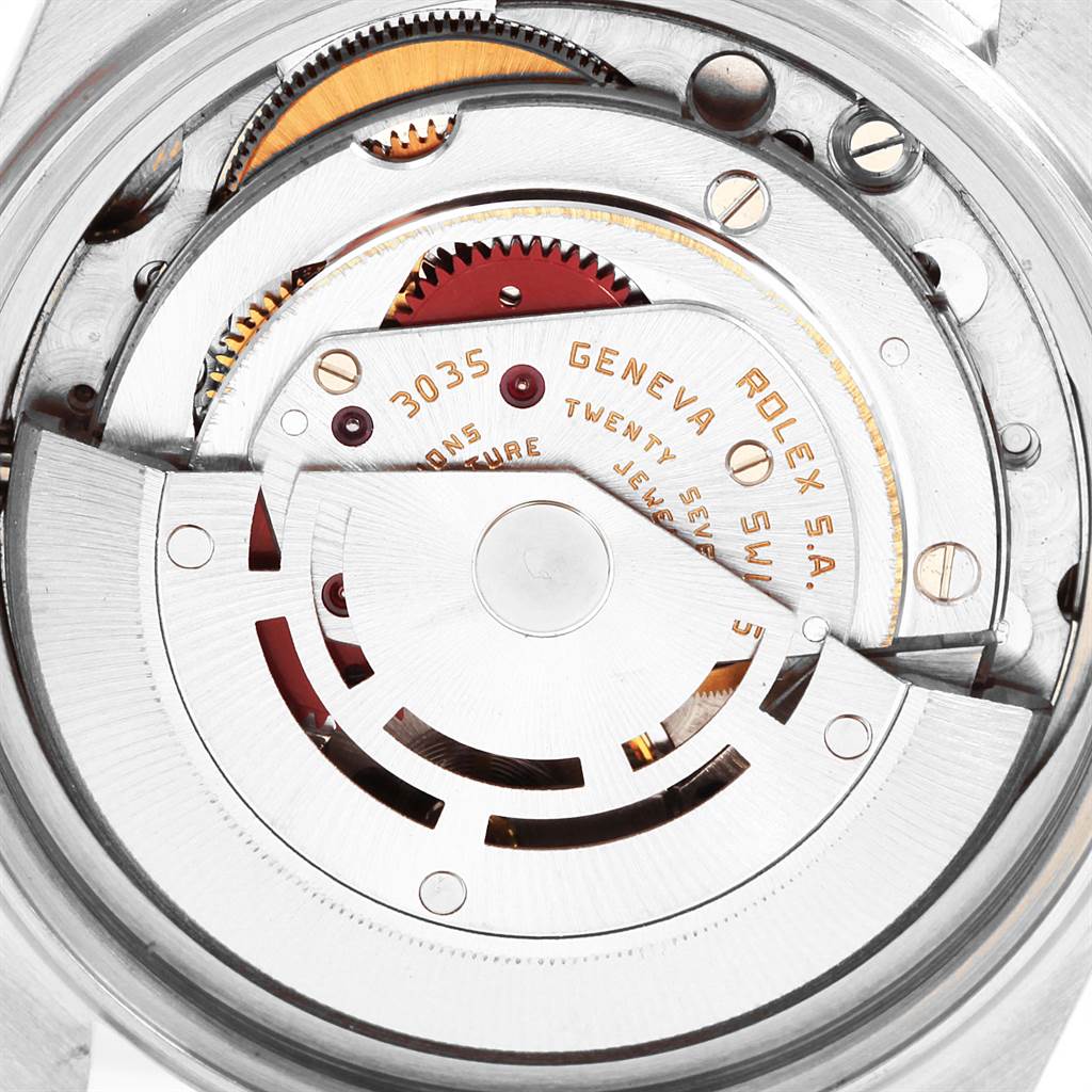 The image shows the intricate internal mechanical movement of a Vintage Collection Rolex watch, captured from the back.