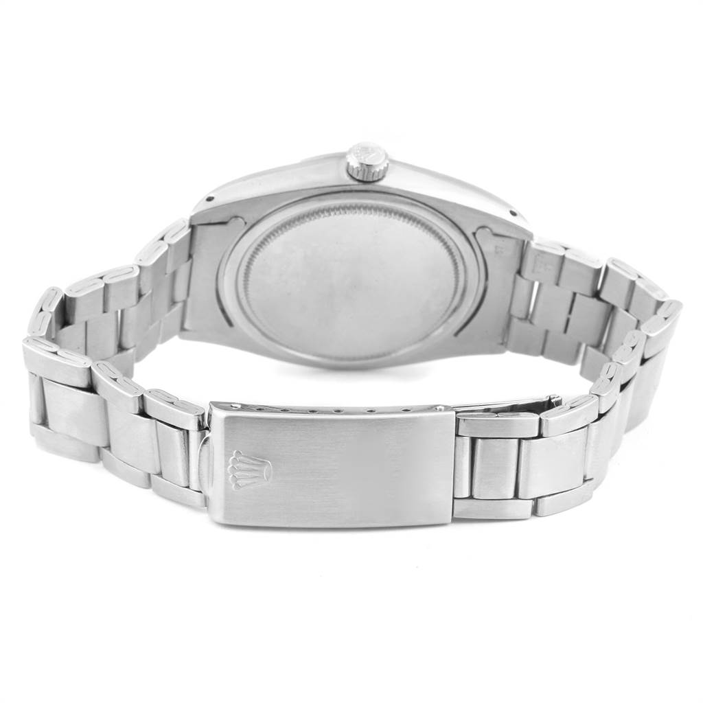 The image shows the back case and bracelet of the Rolex Vintage Collection 6694 Men
s Stainless Steel Silver Dial 6694 Men
s Stainless Steel Silver Dial model watch from a rear angle.
