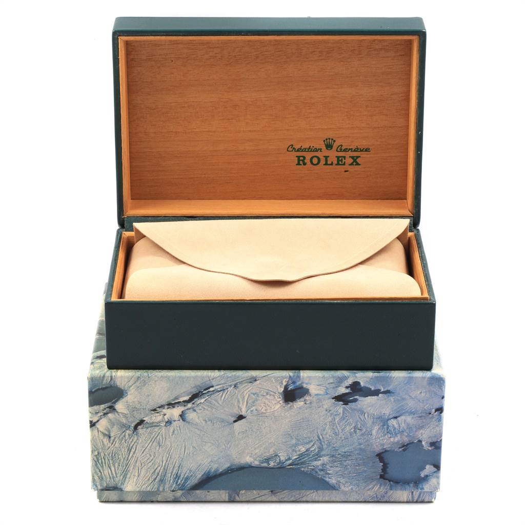 The image shows a Rolex Vintage Collection 1002 Men
s Stainless Steel Silver Dial 1002 Men
s Stainless Steel Silver Dial watch box, featuring an open lid and a leather pouch inside.