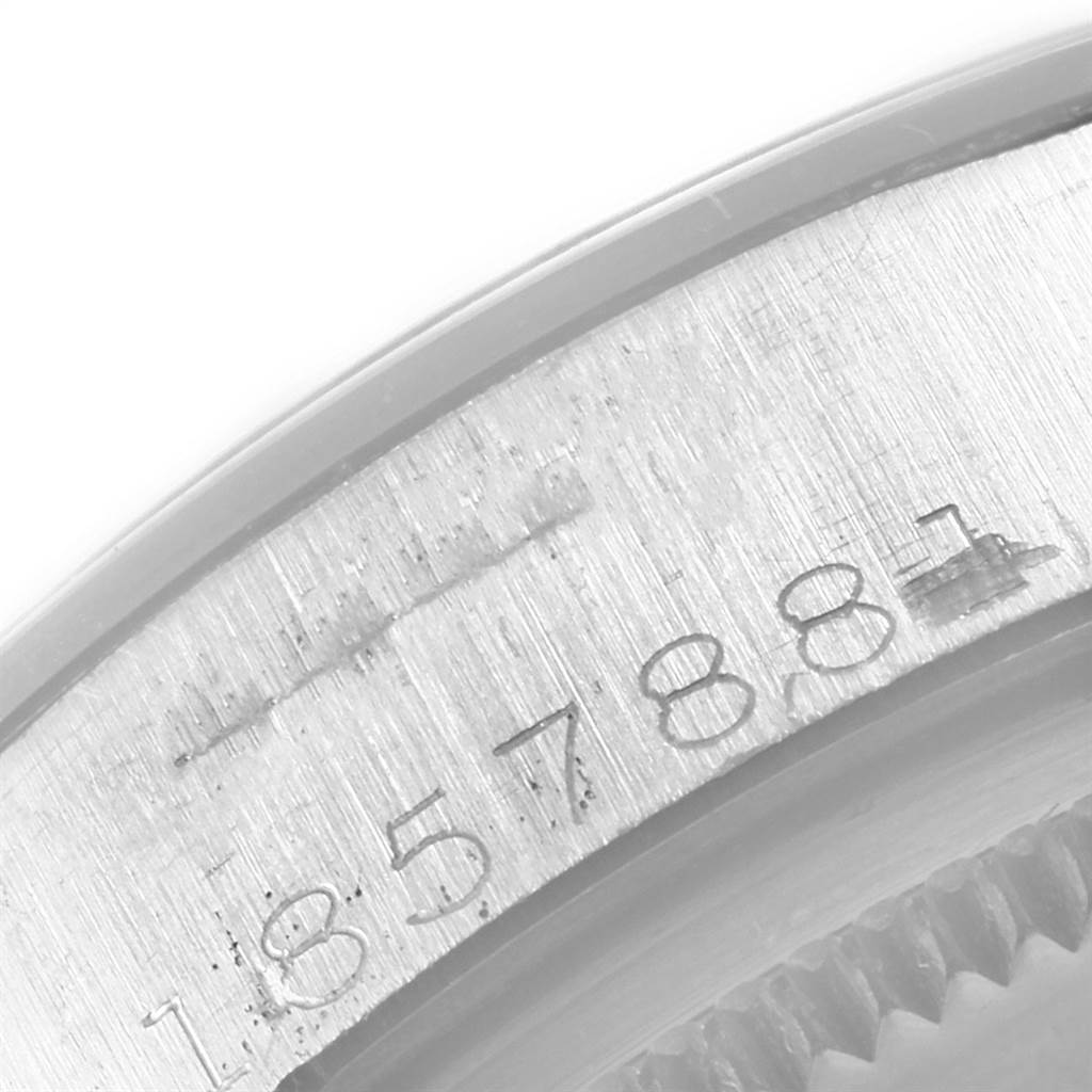 This image shows a close-up of the serial number engraved on the case of a Vintage Collection model by Rolex.