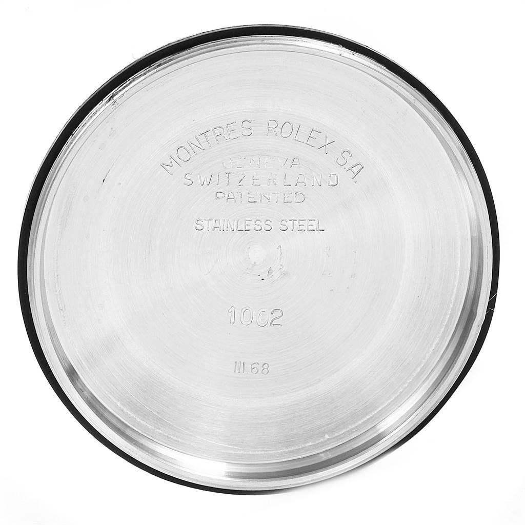 This image shows the interior case back of a Vintage Collection Rolex watch, highlighting the engraved details.