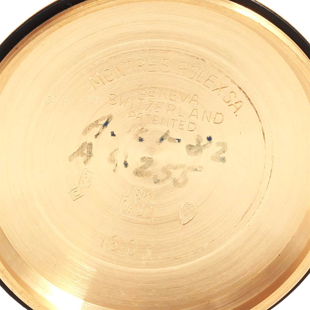 The image shows the inner side of the case back of a Vintage Collection model by Rolex, highlighting the engravings and hallmarks.