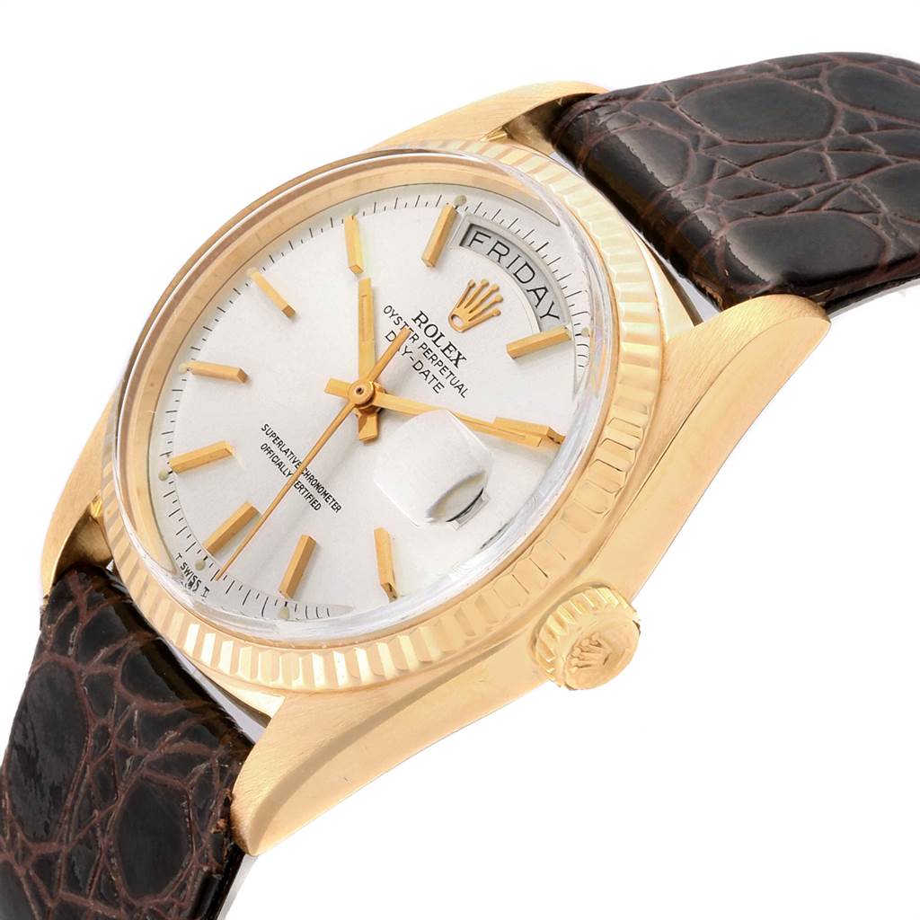 This image shows a side view angle of a Rolex Vintage Collection 1803 Men
s Yellow Gold Silver Dial 1803 Men
s Yellow Gold Silver Dial watch, highlighting its dial, crown, and brown leather strap.