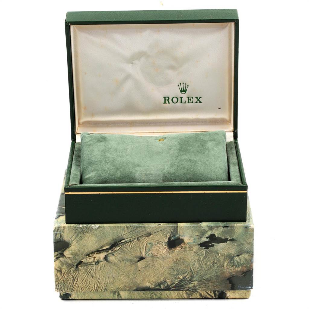 The image shows an open green Rolex box for the Vintage Collection model, revealing a plush cushion inside.