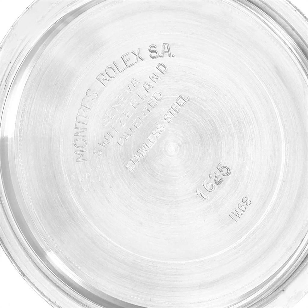 The image shows the inner case back of a Vintage Collection model by Rolex, featuring engraved details and model information.