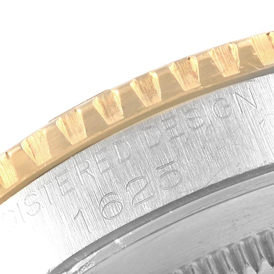The image shows a close-up angle of the bezel and part of the case back inscription of a Vintage Collection model by Rolex.
