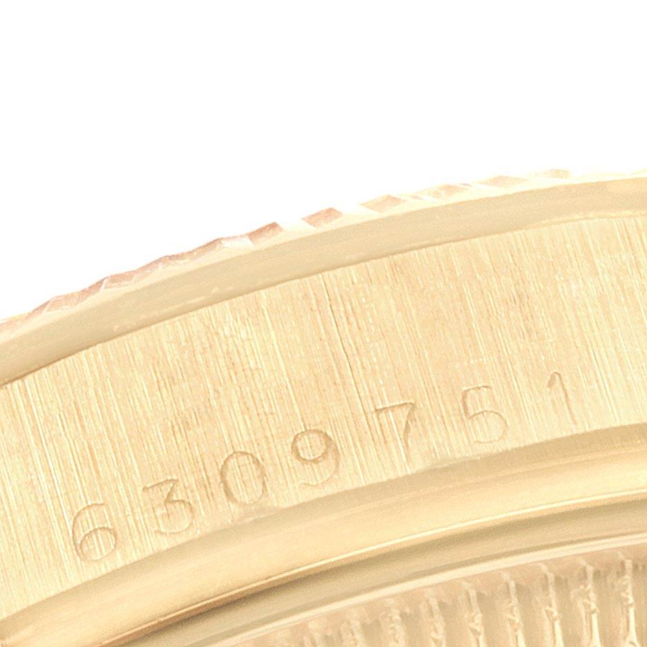 This close-up image of the Vintage Collection model by Rolex shows a detailed view of the watch
s engraved serial number on the case.