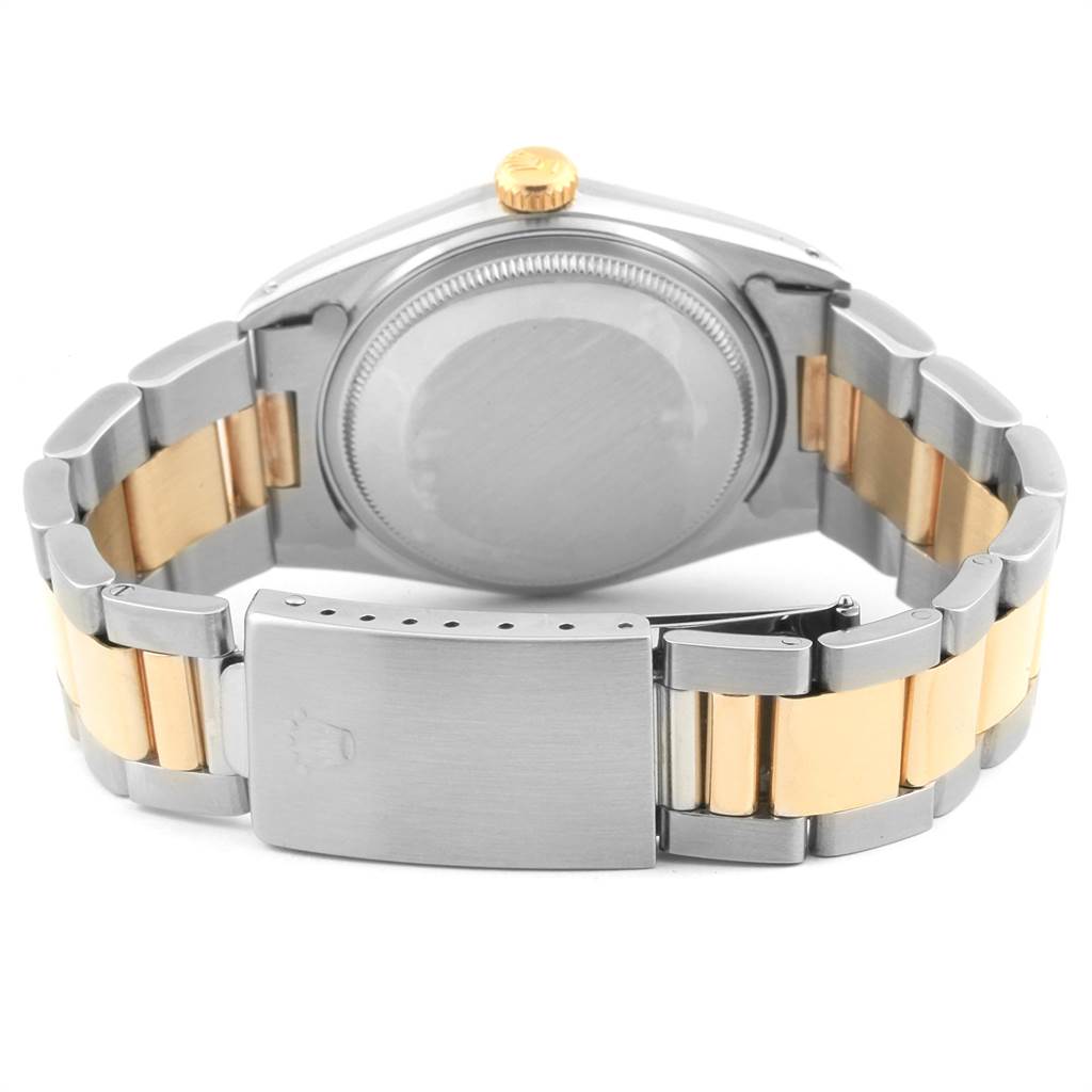 The image shows the back view of a Rolex Vintage Collection 16013 Men's Stainless Steel Champagne Dial 16013 Men's Stainless Steel Champagne Dial model watch, highlighting its case back and two-tone metal bracelet.