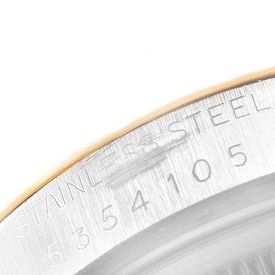 The image shows a close-up of the side of a Rolex Vintage Collection 16013 Men's Stainless Steel Champagne Dial 16013 Men's Stainless Steel Champagne Dial watch, featuring the engraved "STAINLESS STEEL" and serial numbers.