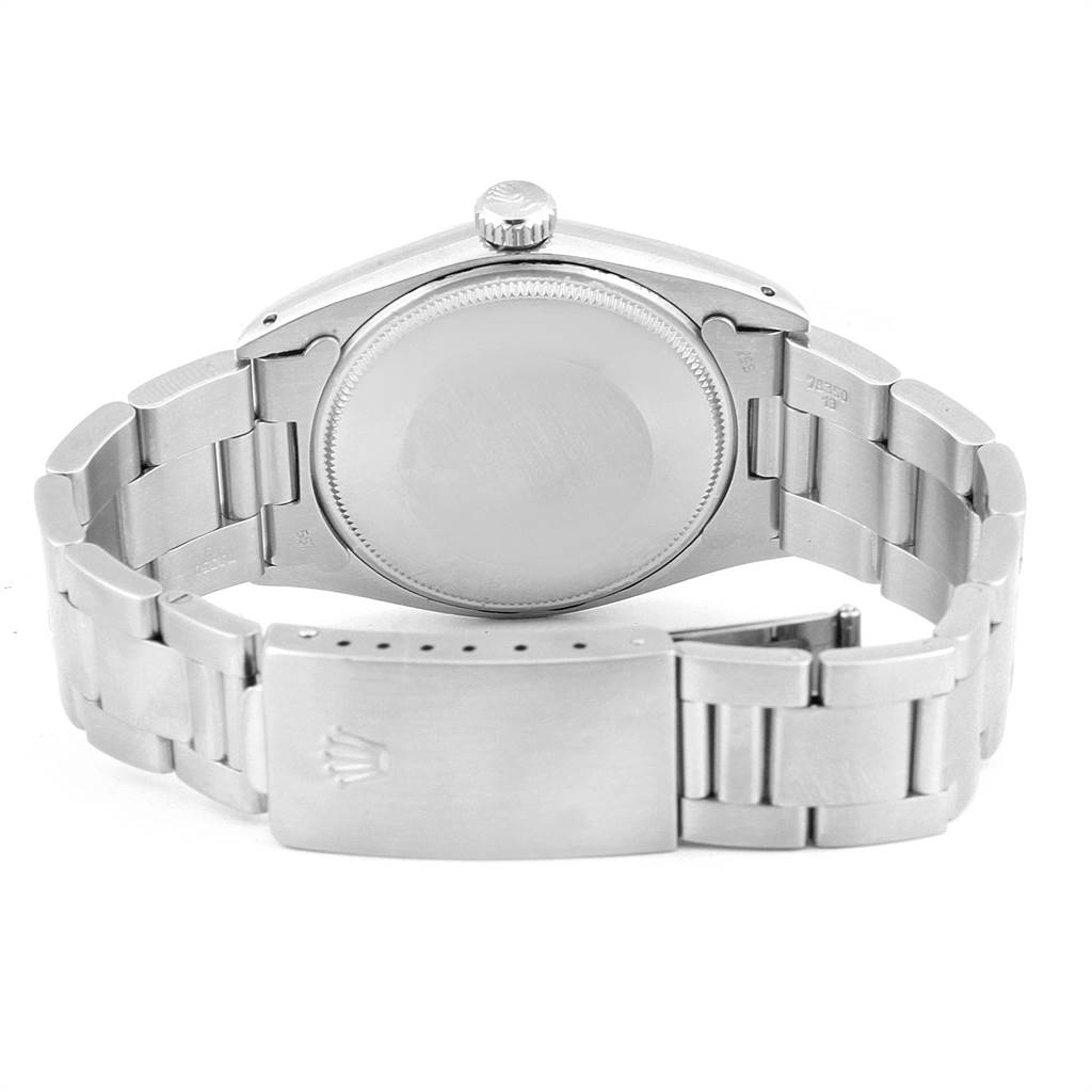 The image shows the back view of a Vintage Collection Rolex watch, highlighting the bracelet, clasp, case back, and crown.