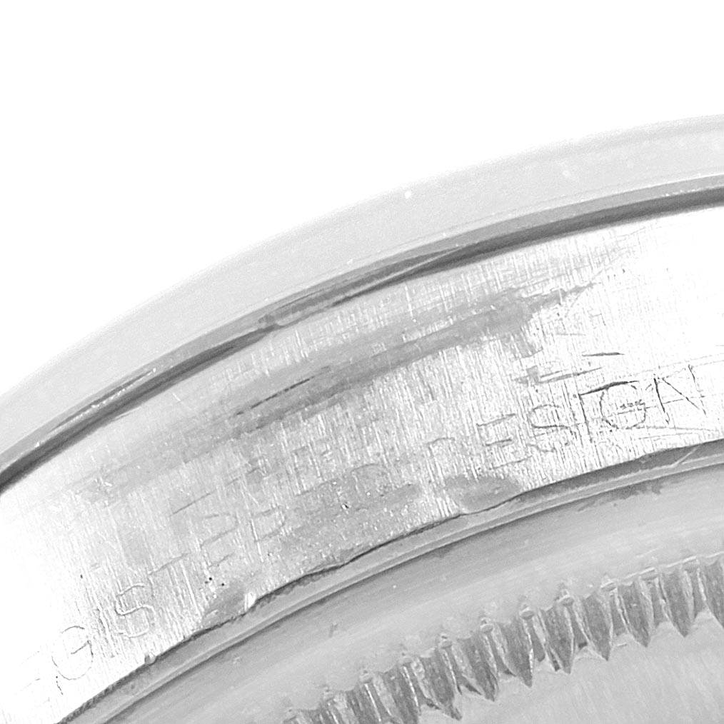 This image shows a close-up angle of the engraved text on the case back rim of the Rolex Vintage Collection 1500 Men
s Stainless Steel Silver Dial 1500 Men
s Stainless Steel Silver Dial model.