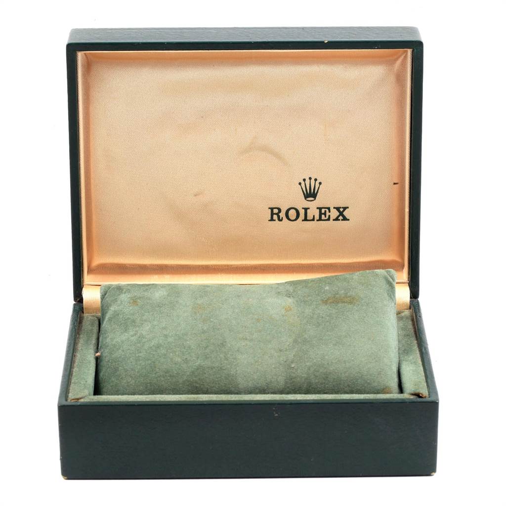 The image shows an open box for the Rolex Vintage Collection 1500 Men
s Stainless Steel Silver Dial 1500 Men
s Stainless Steel Silver Dial model watch with a green cushioned interior and the Rolex brand logo.