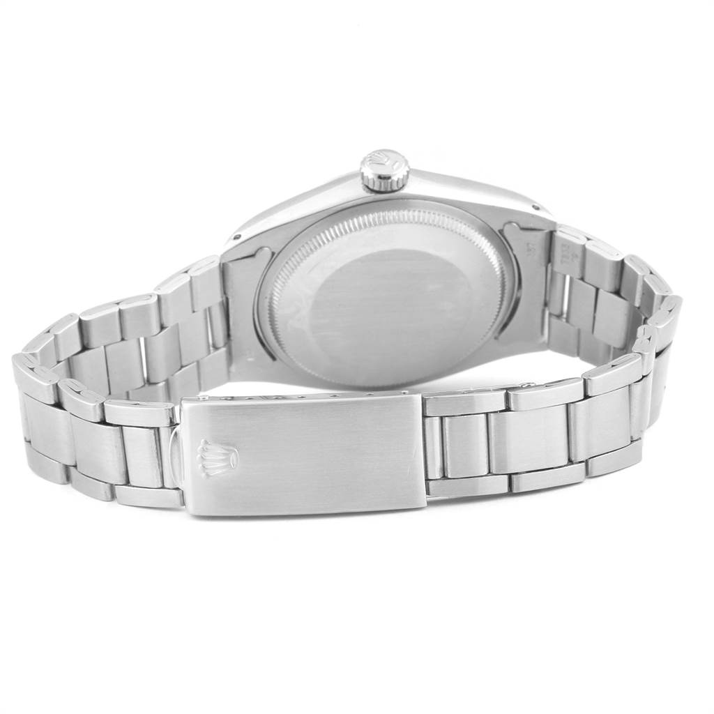 The image shows the back and bracelet of a Rolex Vintage Collection 1500 Men
s Stainless Steel Silver Dial 1500 Men
s Stainless Steel Silver Dial watch, highlighting the clasp and case back.