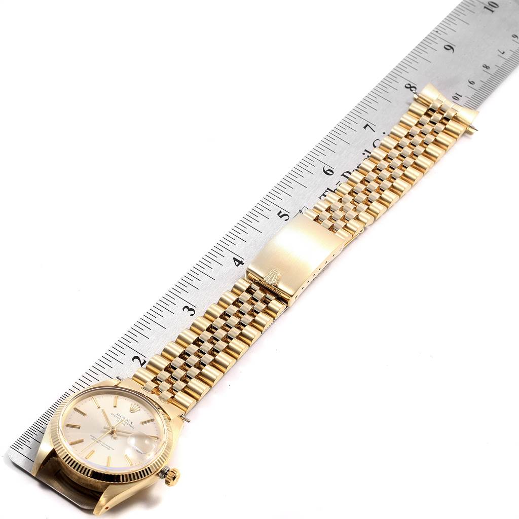 The image shows a Vintage Collection Rolex watch fully extended with a measuring ruler beside it, highlighting the watch face and bracelet.