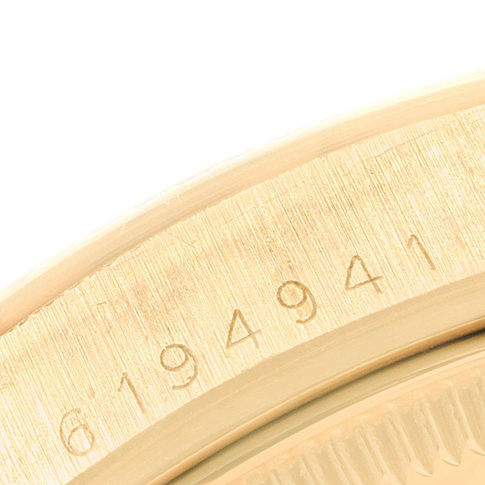 The image shows a close-up view of the serial number engraved on the bezel of a Rolex Vintage Collection 1503 Men
s Yellow Gold Silver Dial 1503 Men
s Yellow Gold Silver Dial watch.