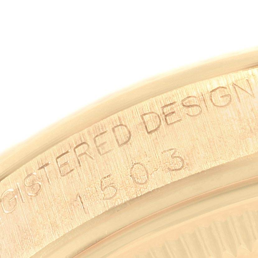 This image shows a close-up view of the outer rim of the Rolex Vintage Collection 1503 Men
s Yellow Gold Silver Dial 1503 Men
s Yellow Gold Silver Dial model, displaying the engraved serial and design numbers.