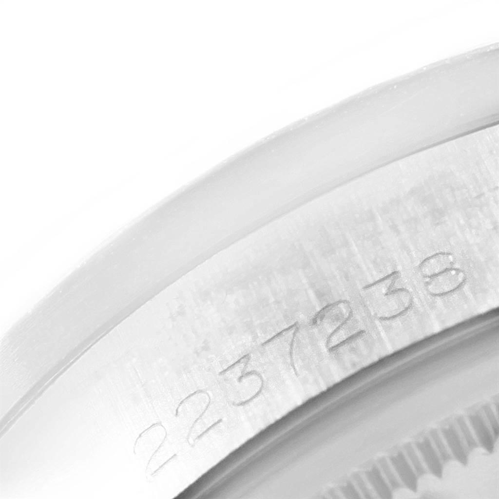 This image shows a close-up view of the serial number engraved on the rim of a Rolex Vintage Collection 1501 Men
s Stainless Steel Silver Dial 1501 Men
s Stainless Steel Silver Dial model watch.