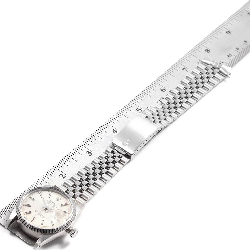 The Rolex Vintage Collection 16030 Men's Stainless Steel Silver Dial 16030 Men's Stainless Steel Silver Dial watch is shown laid flat with a metal ruler measuring its length.