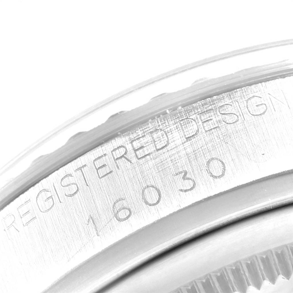 The image shows an extreme close-up of the case rim displaying the "REGISTERED DESIGN 16030" marking for a Vintage Collection Rolex watch.