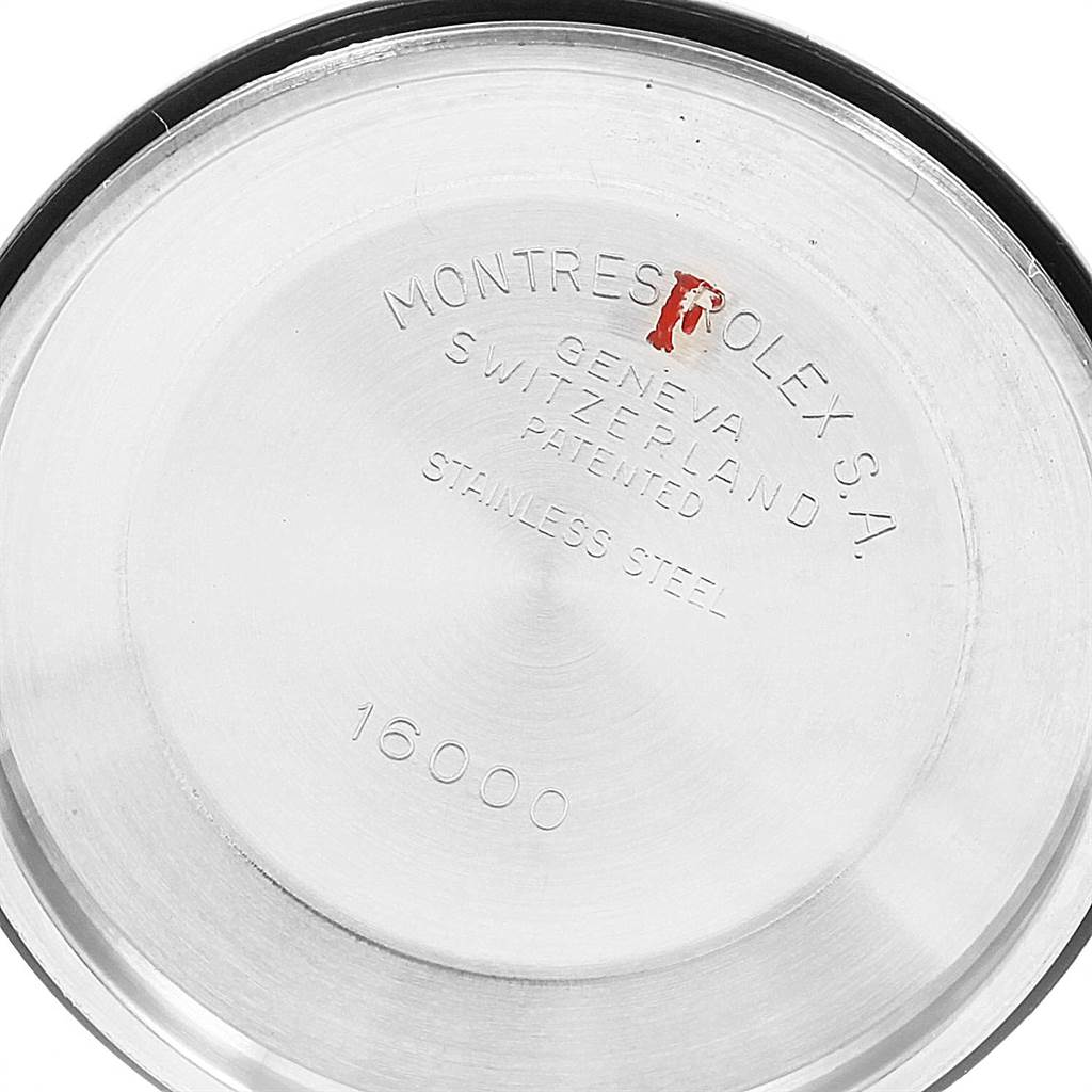 This image shows the engraved stainless steel case back of a Vintage Collection Rolex watch, viewed from the inside.