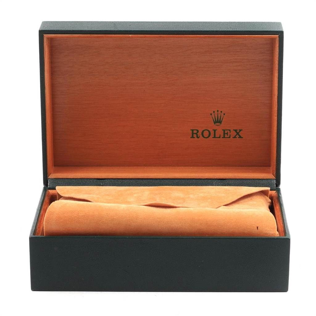 The image shows an open Rolex watch box from the Vintage Collection, displaying its interior and a rolled-up fabric insert.
