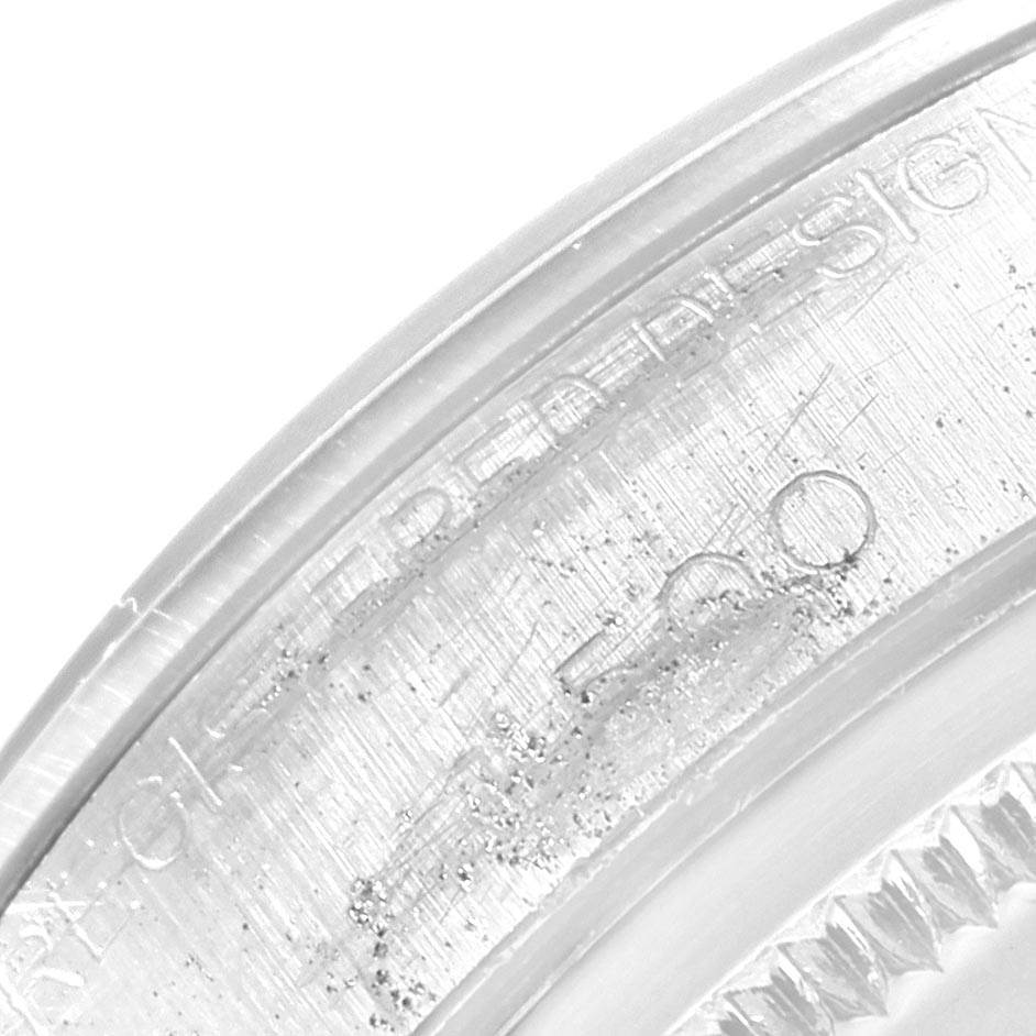 This close-up shows the engravings on the bezel of the Rolex Vintage Collection 1500 Men's Stainless Steel Silver Dial 1500 Men's Stainless Steel Silver Dial model.