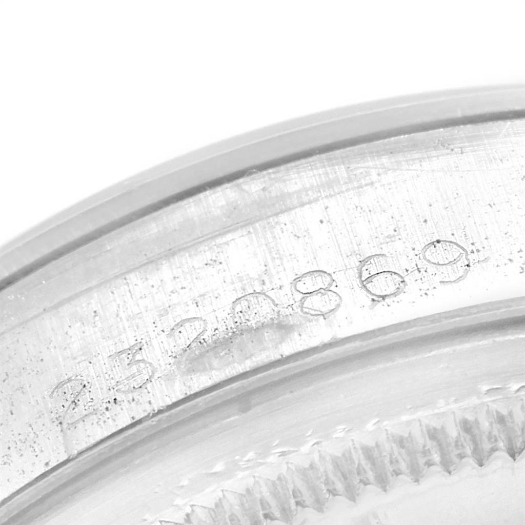 The image shows a close-up of the serial number on the outer casing of a Vintage Collection Rolex watch.