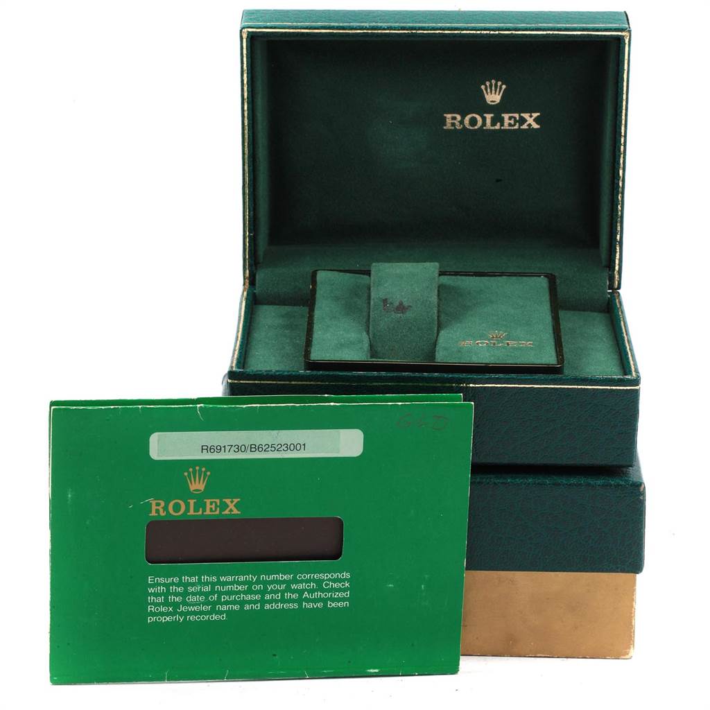 The image shows the packaging and warranty card for a Vintage Collection model by Rolex.
