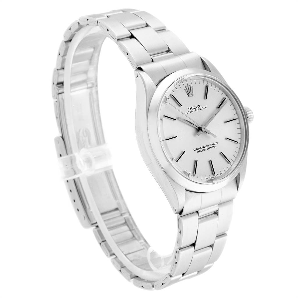 The Vintage Collection Rolex watch is shown at an angle highlighting its face, bezel, and stainless steel bracelet.