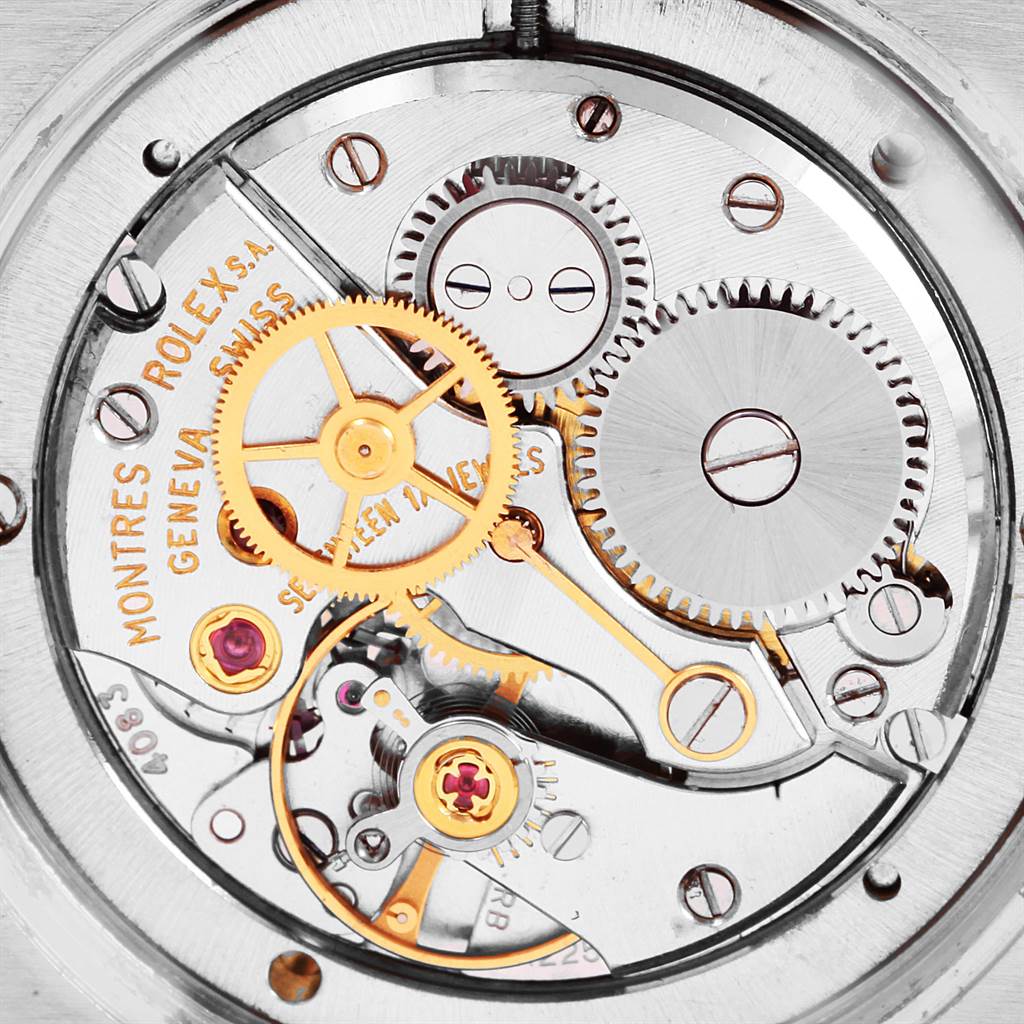 The image shows the intricate internal mechanism of the Rolex Vintage Collection 6694 Men
s Stainless Steel Silver Dial 6694 Men
s Stainless Steel Silver Dial watch from a close-up, top-down angle.