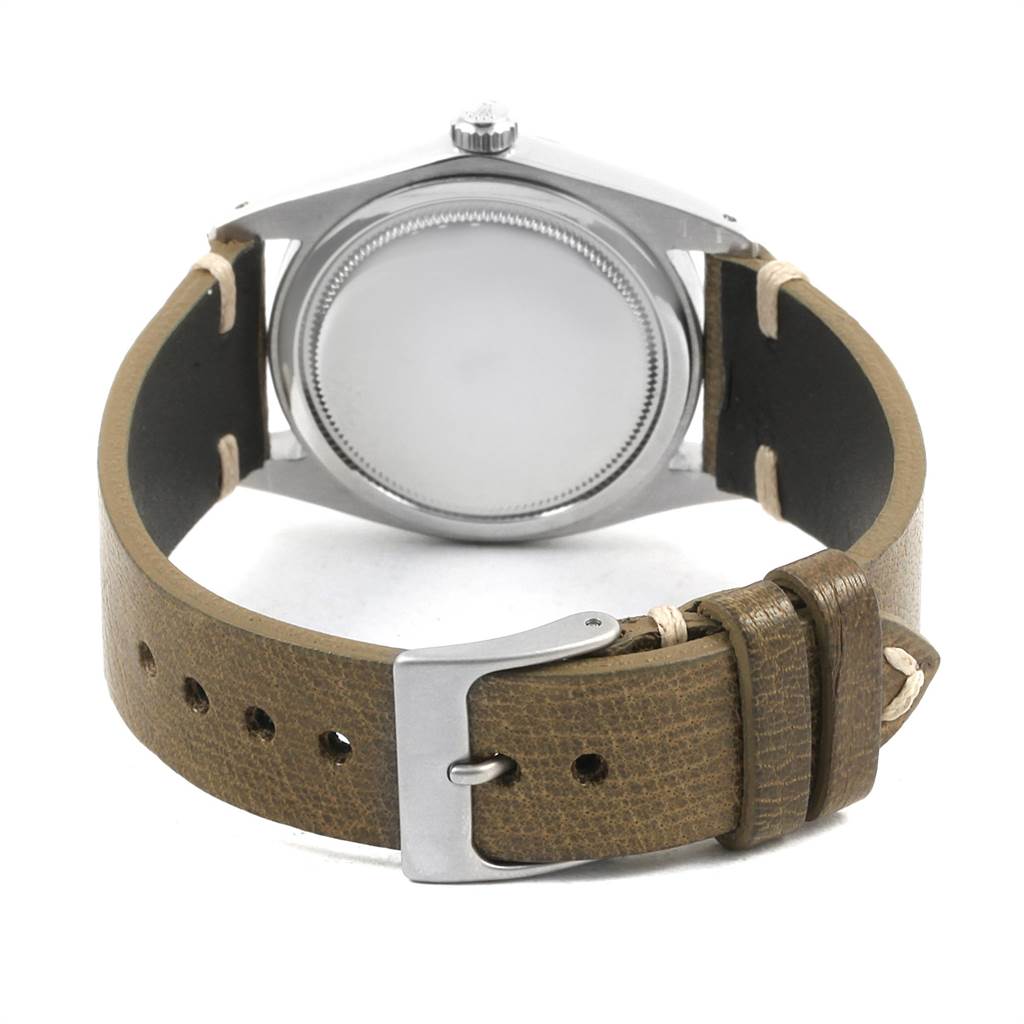 This image shows the back view of the casing and brown leather strap of a Rolex Vintage Collection 6694 Men
s Stainless Steel Silver Dial 6694 Men
s Stainless Steel Silver Dial watch.
