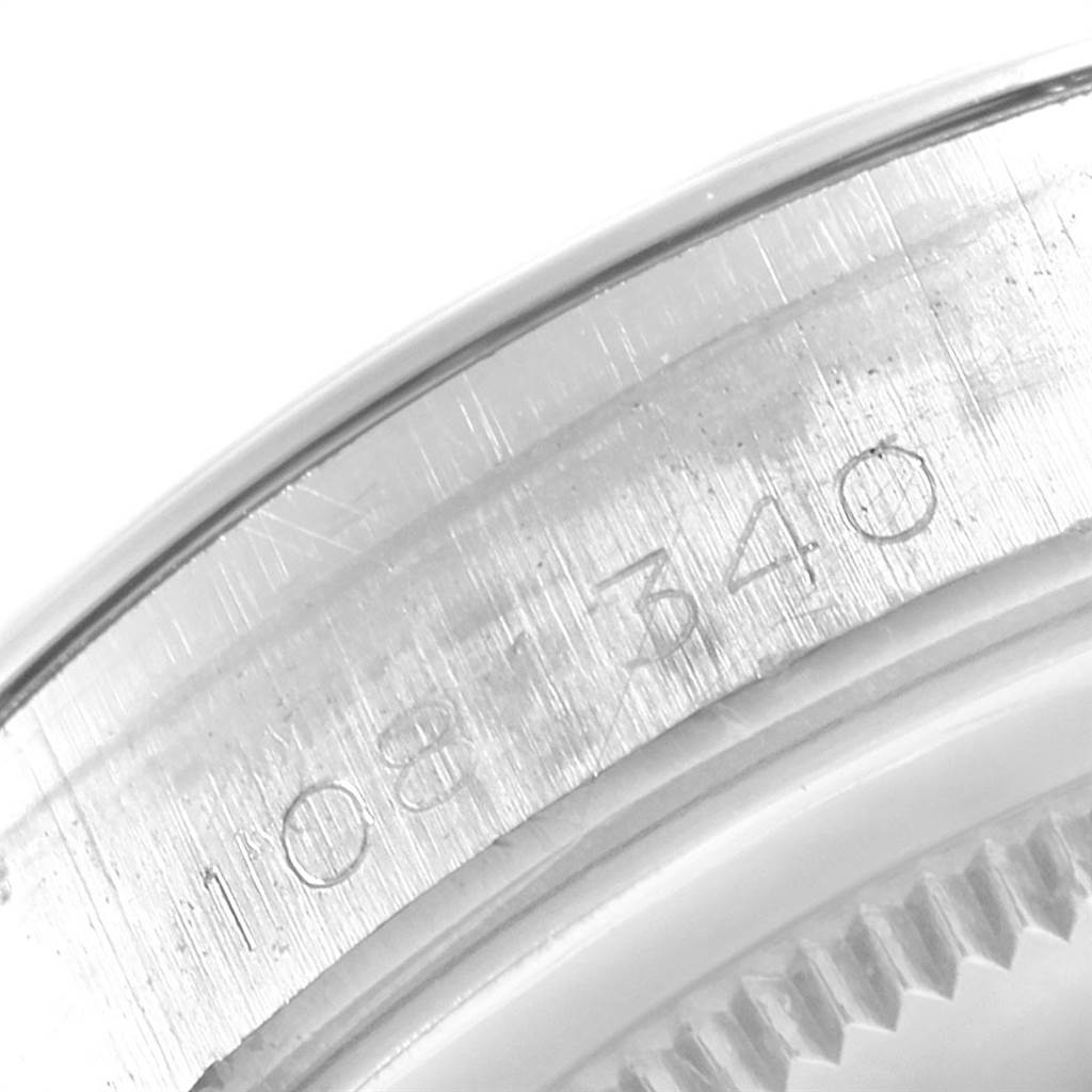 This close-up image shows the serial number engraved on the side of the Rolex Vintage Collection 6694 Men
s Stainless Steel Silver Dial 6694 Men
s Stainless Steel Silver Dial watch case.