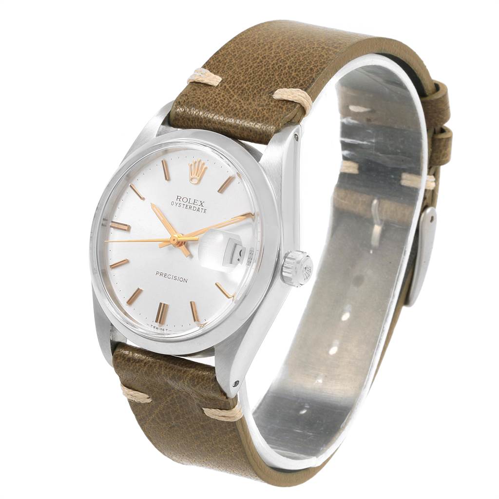 The image shows a Rolex Vintage Collection 6694 Men
s Stainless Steel Silver Dial 6694 Men
s Stainless Steel Silver Dial watch at a three-quarter angle, highlighting the dial, crown, and brown leather strap.