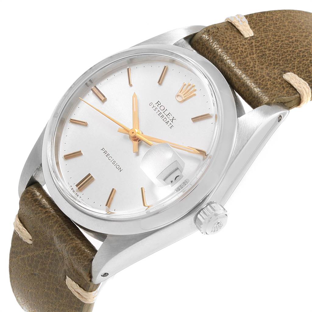 The image shows a Rolex Vintage Collection 6694 Men
s Stainless Steel Silver Dial 6694 Men
s Stainless Steel Silver Dial watch at a slight angle, highlighting the face, crown, and part of the strap.