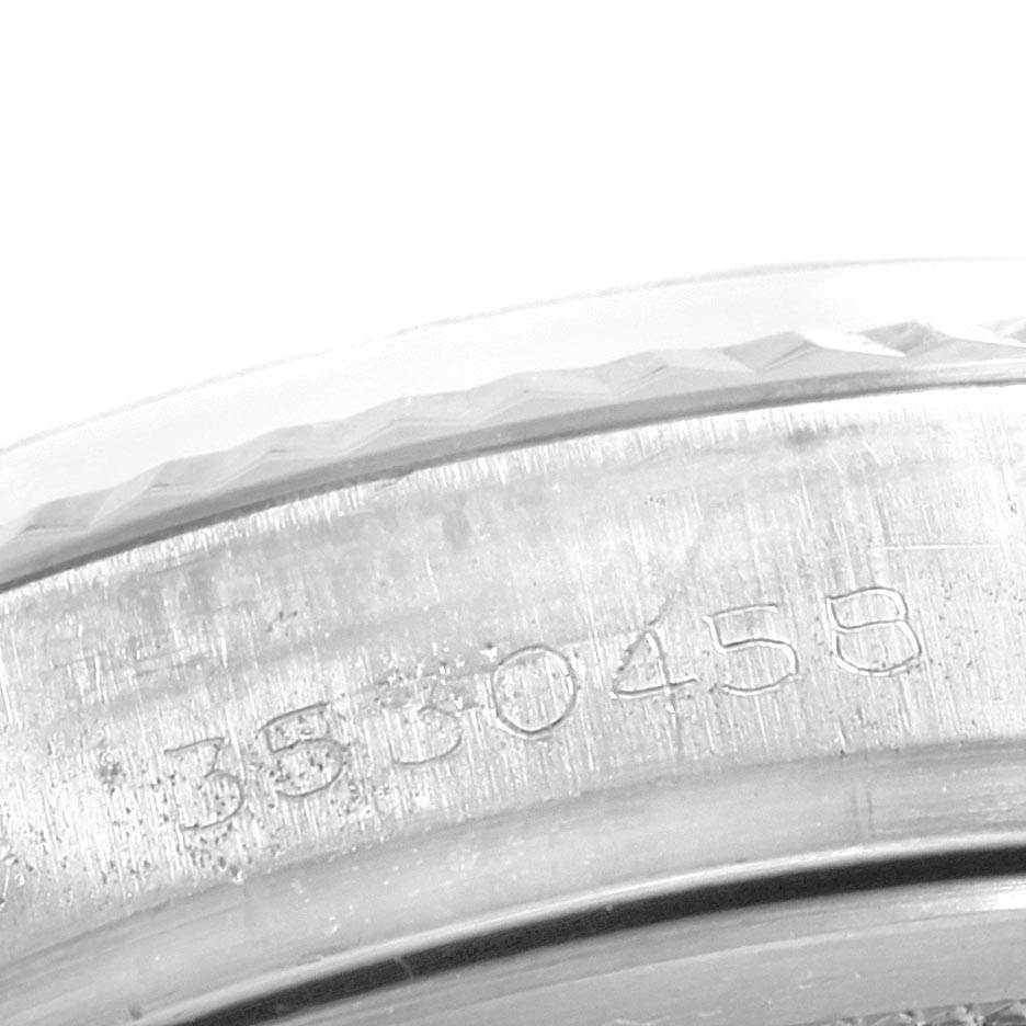 This image shows a close-up view of the serial number engraving on the case of a Rolex Vintage Collection 1601 Men's Stainless Steel Green Dial 1601 Men's Stainless Steel Green Dial model watch.