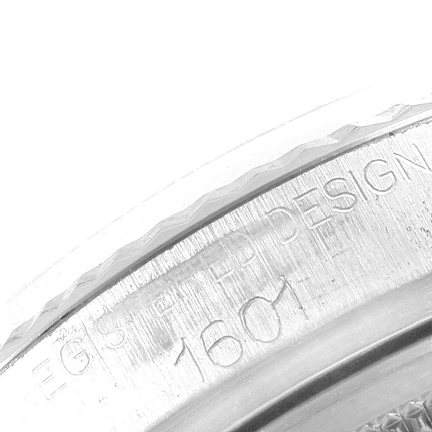The image shows a close-up of the engraved inner bezel of a Rolex Vintage Collection 1601 Men's Stainless Steel Green Dial 1601 Men's Stainless Steel Green Dial model watch.