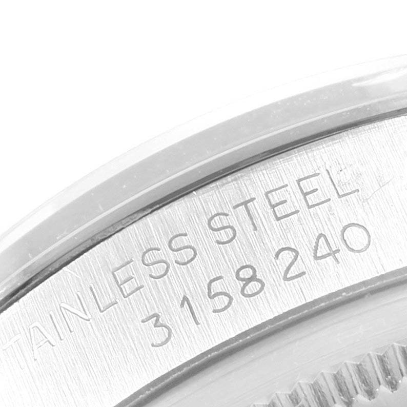 This close-up angle shows the stainless steel back of the Rolex Vintage Collection 1500 Men
s Stainless Steel Silver Dial 1500 Men
s Stainless Steel Silver Dial watch with its serial number.