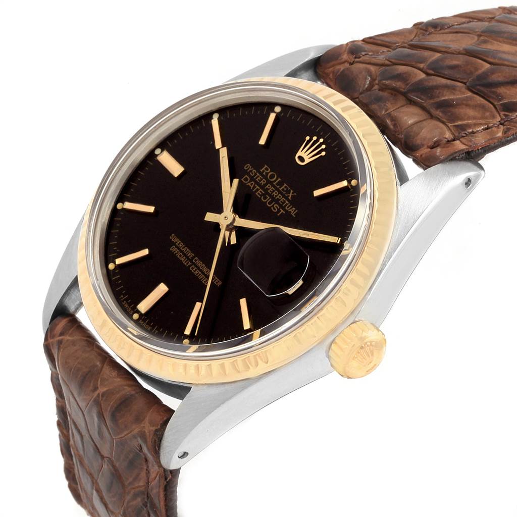 The image shows a Vintage Collection Rolex watch at a slight angle, highlighting the black dial, brown leather strap, and gold crown.
