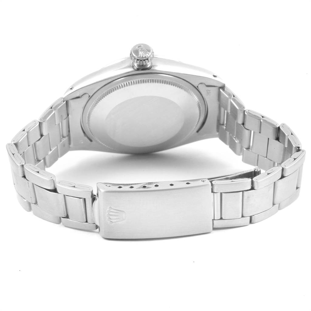 The image shows the back view of the Rolex Vintage Collection 1500 Men's Stainless Steel Silver Dial 1500 Men's Stainless Steel Silver Dial watch, highlighting the case back, crown, and metal bracelet with clasp.